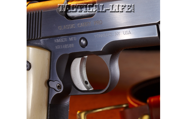 The slide stop pin is recessed and surrounded by a beveled opening. The serrated face of the single- action trigger is specific only to this model.