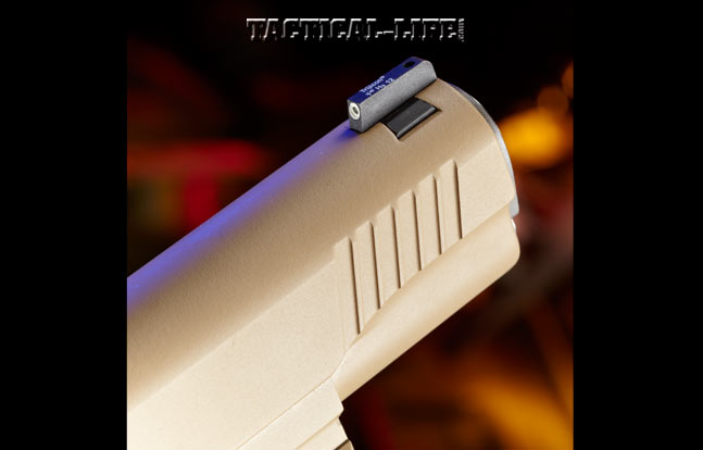 The front sight is drift-adjustable and has a tritium dot that is activated by any light source. The serrations at the slide’s muzzle-end (shown) and rear offer the user a secure purchase.