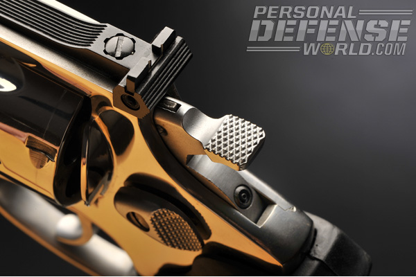 Almost any small screwdriver will fit the elevation screw for the rear sight.