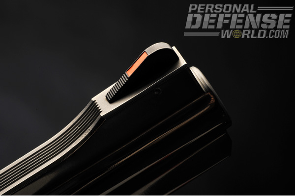 The serrated front sight blade is a ramp design and includes a bright red-orange insert.