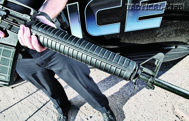 Round polymer handguards with double heatshields cover the rifle-length gas system and the Parkerized and chrome-lined barrel.