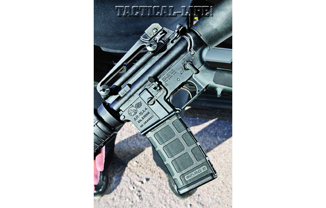 Colt’s AR-15A4 is an amalgam of the old and the new. Note the standard hinged triggerguard, A2-style pistol grip and Magpul PMAG.