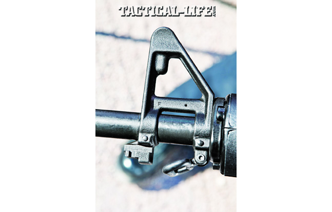 Colt’s AR-15A4 has a fixed front sight tower that incorporates a square, elevation-adjustable sight post, a bayonet lug and a sling loop.