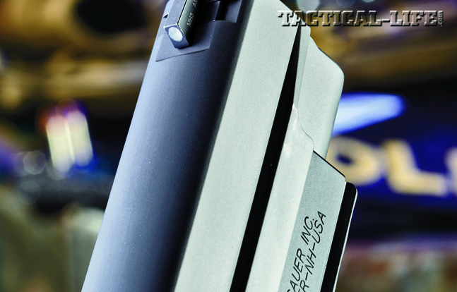 The high-visibility SIGLITE front night sight is mounted in a dovetail. Note the smooth, rounded contours of the Nitron-finished slide.