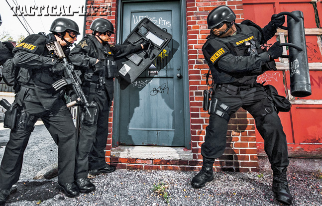 Fully equipped STAR team members practice breaching a door in the heart of downtown Indianapolis. The team trains hard and takes it very seriously for successful missions.