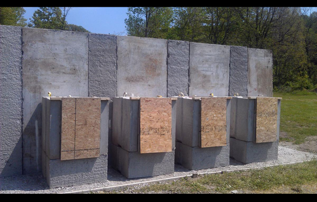 High Volume Shooting Range with Expendable SACON Bullet Traps, Wood Target Hangers and SACON T-Panel Backstop.