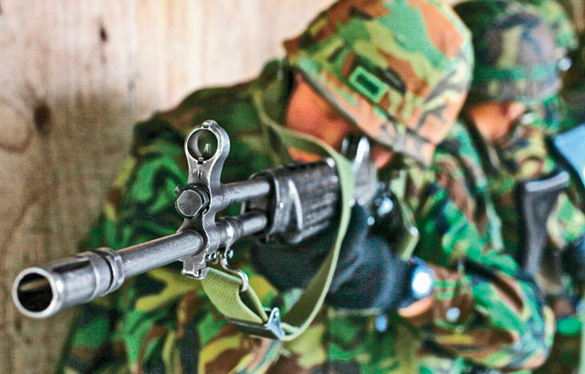 During a building-clearing exercise, an ROK Marine aims his K2 assault rifle.
