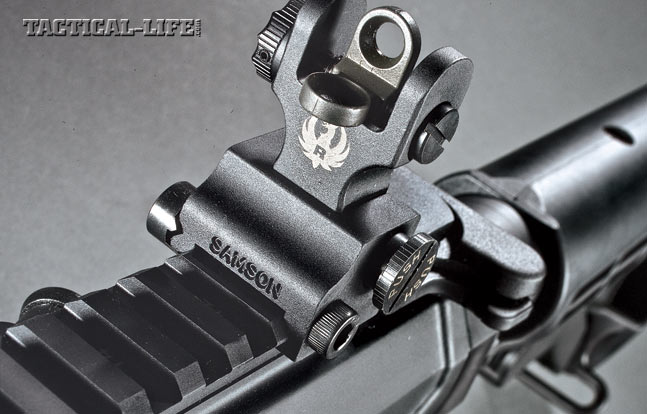 The rifle comes with folding backup iron sights, including a windage-adjustable rear sight
