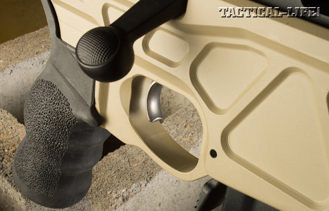 The enlarged triggerguard is machined into the center section of the stock. Also note the subtle checkering on the tactical bolt knob.