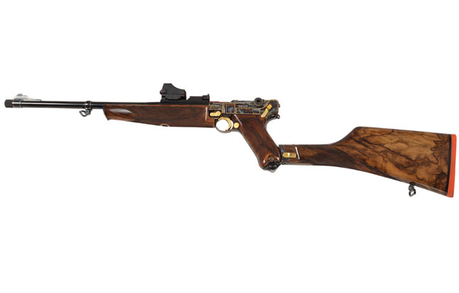 Thomas Spohr built this P-08 carbine on an original Luger frame. Newly manufactured "Broomhandle" C96 versions that use detachable box magazines were also available at IWA 2014