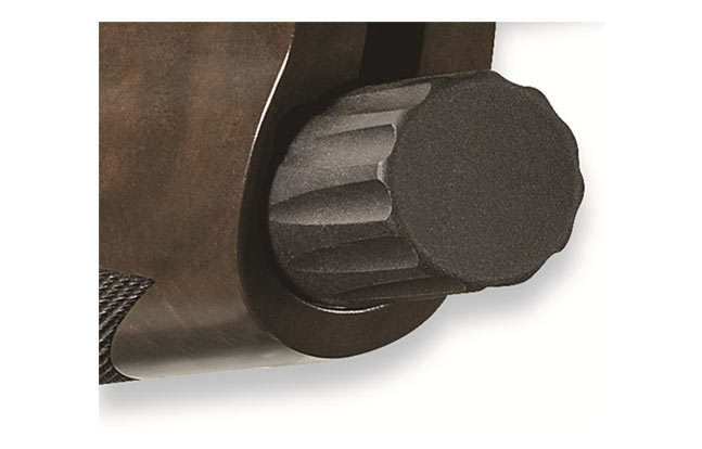 Synthetic bushing incorporated into magazine cap prevents the cap from binding under all environmental conditions, including dust, dirt, moisture and freezing temperatures.