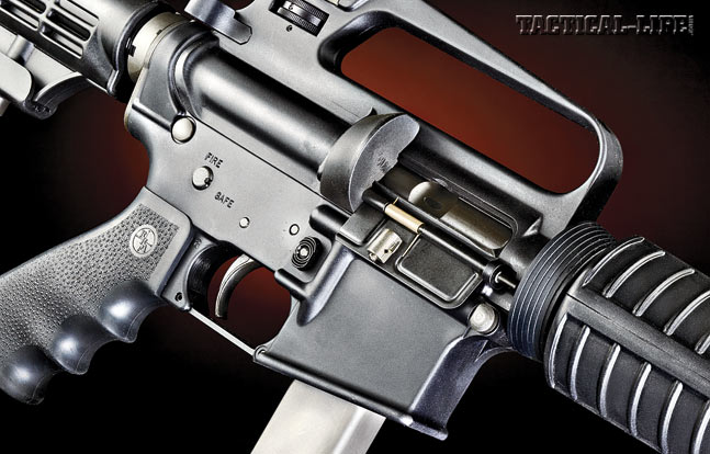 The right side of the receiver highlights the LAR-9’s 9mm chambering. Note the shortened ejection port and rounded shell deflector.