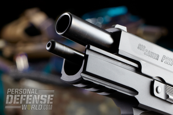 The Sig Sauer P227 Nitron features a 4.4-inch barrel and a polymer full-length guide rod. Note the machined accessory rail onto the dust cover.