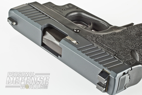 Sniper Gray Cerakote and black Salt Bath Nitride finish the slide and barrel on the CM9.