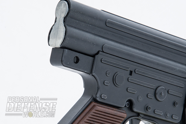 The upper receiver separates from the buttstock group, allowing the bolt carrier to be removed for cleaning.