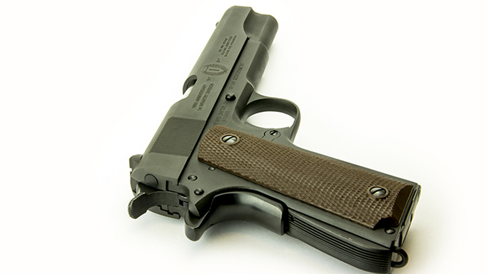 Inland M1 Carbine and 1911a1 handgun rear