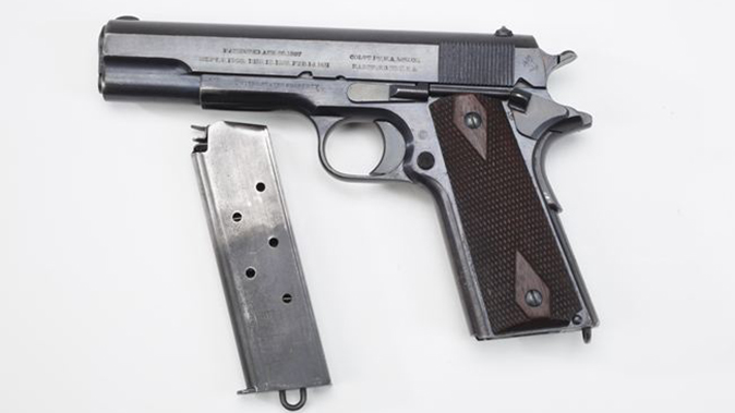 us army surplus m1911 pistol left profile with magazine