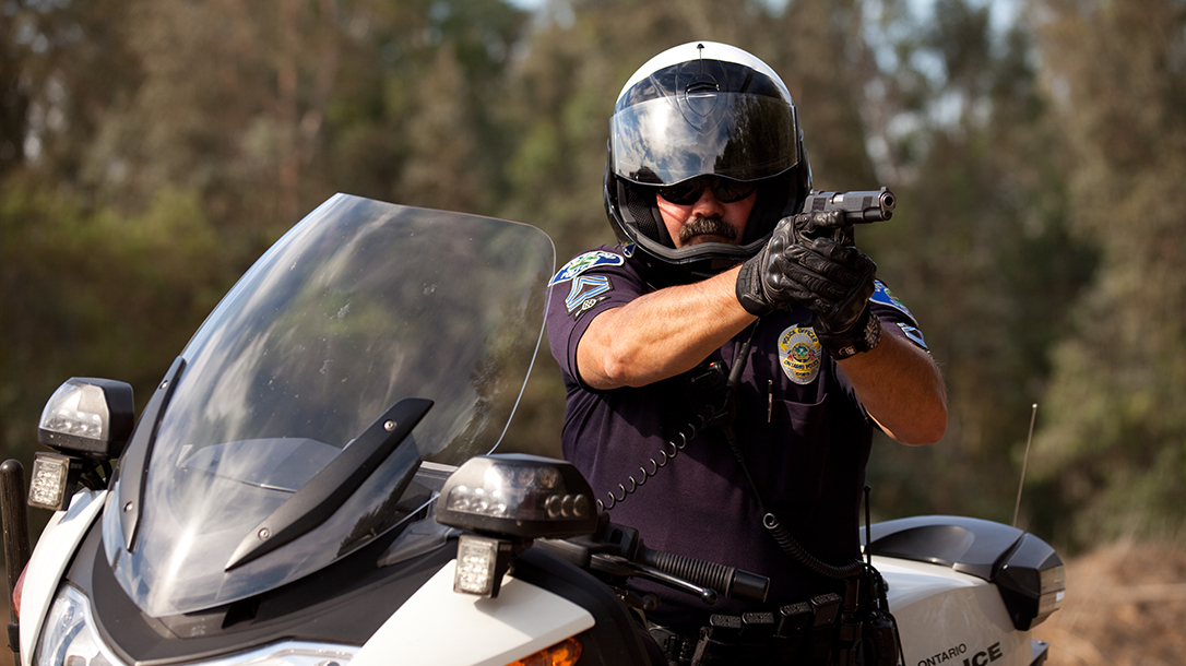 Carrying 1911 Duty Pistol aiming