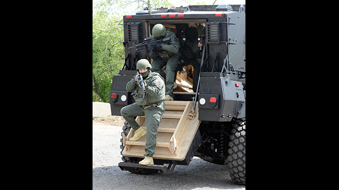 mrap vehicle police exiting