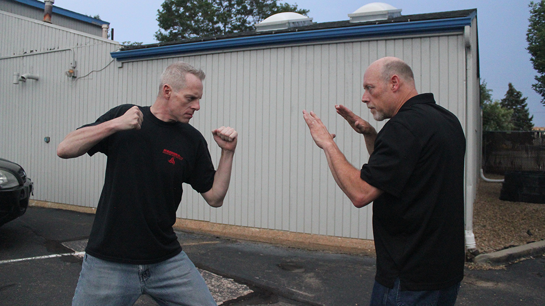 Shoulder Stop, self-defense, punch, step 1