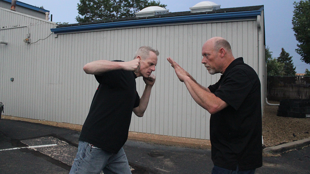 Shoulder Stop, self-defense, punch, step 2