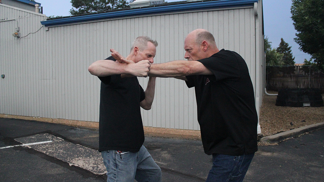 Shoulder Stop, self-defense, punch, step 3