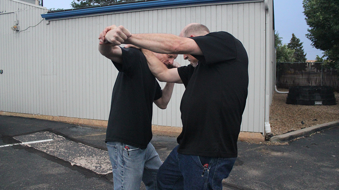 Shoulder Stop, self-defense, punch, step 4