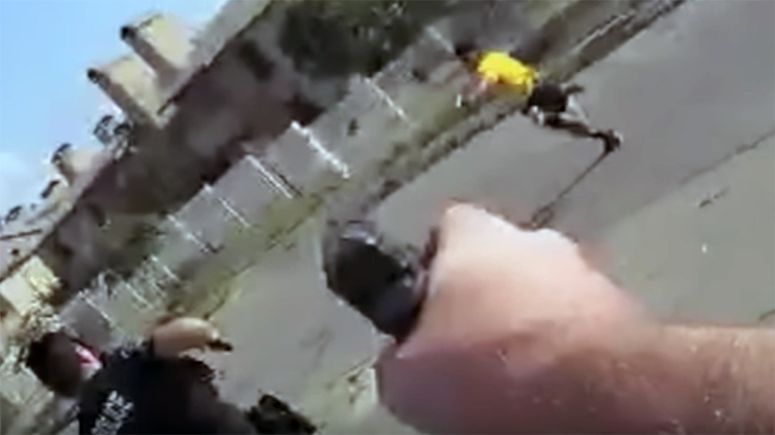 Amari Malone pointed gun at officers.