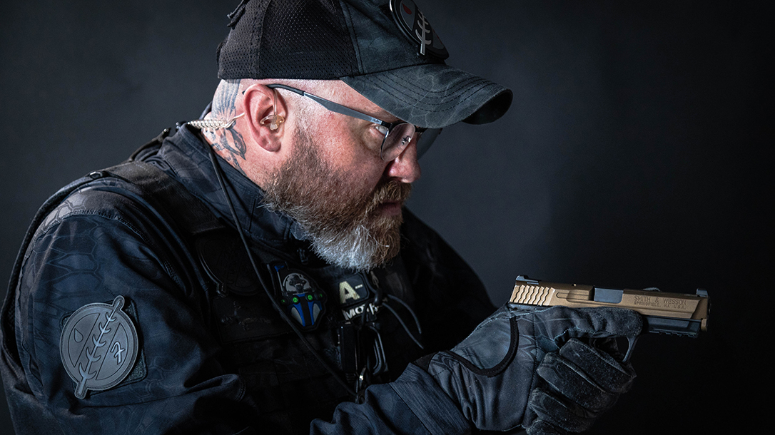 The bounty hunter sticks to handguns mostly, operating in close quarters.