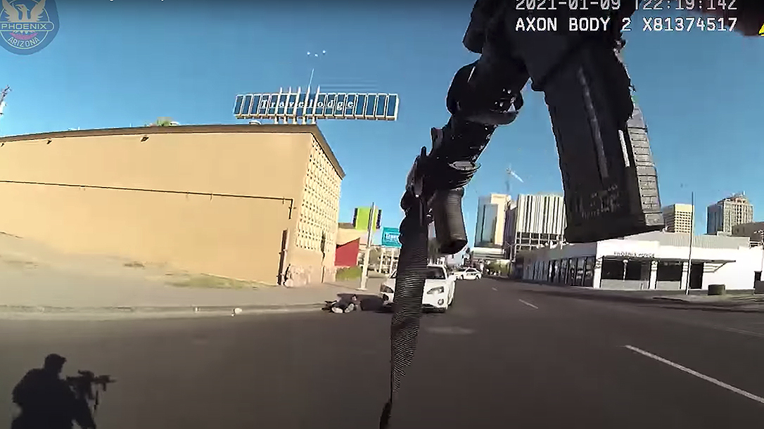A Phoenix supercop dropped a suspect holding a baby hostage with one shot.
