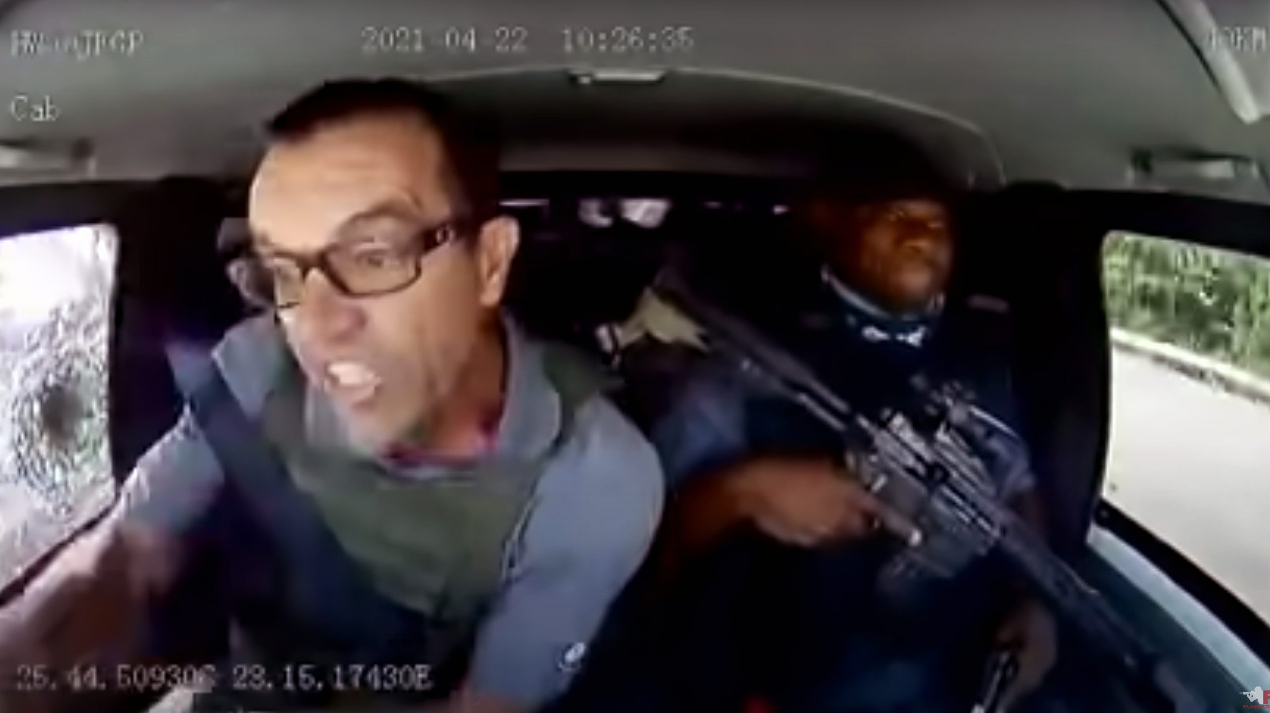 An armored car driver held off an armed attack and kept on driving.