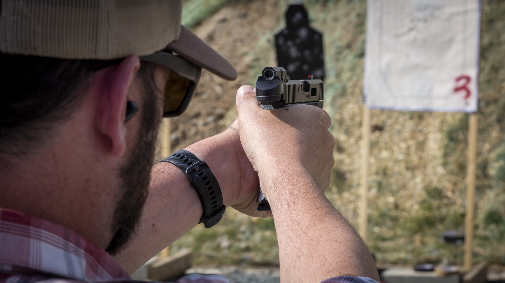 man at outdoor shooting range