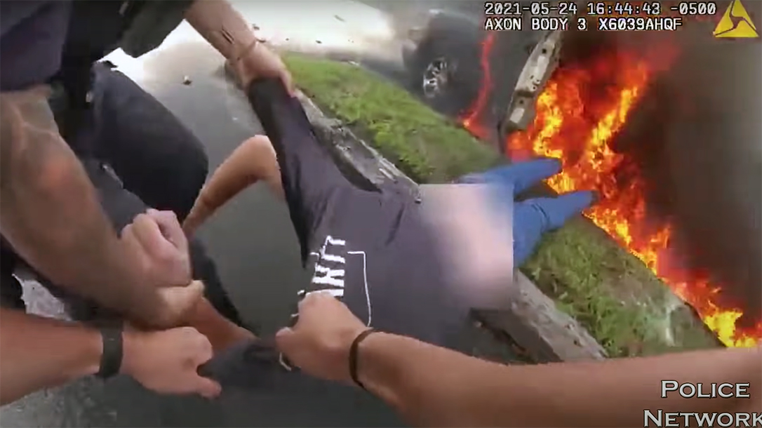A pair of hero cops pulled a man from a burning truck in Austin, Texas.