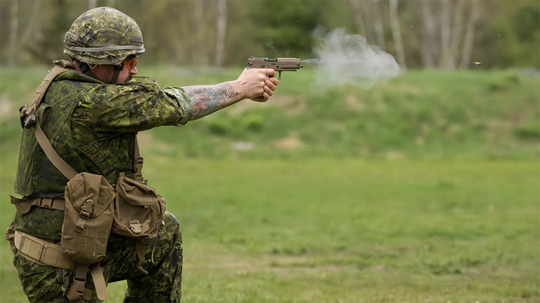 A Canadian Armed Forces soldier shoots the SIG P320.