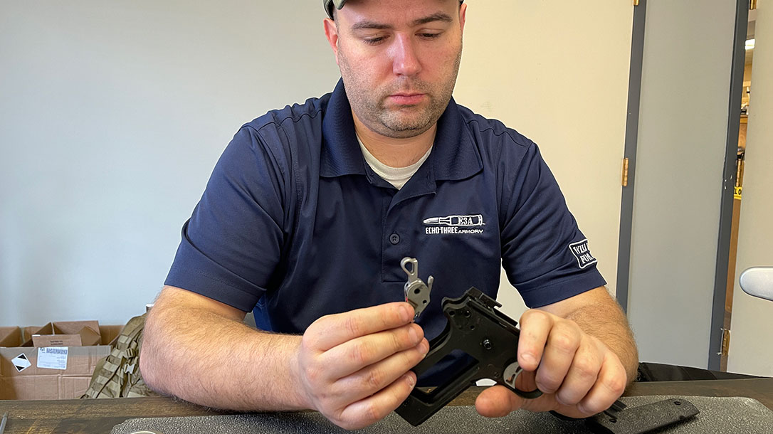 Placing hammer/sear in pistol.