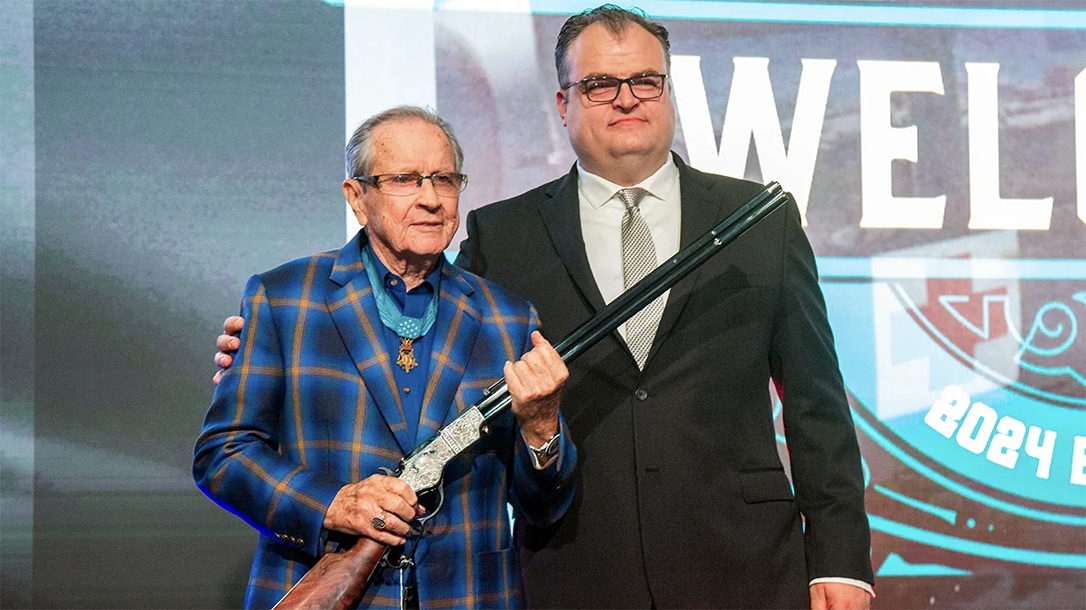 Henry presented a rifle to honor Army Maj. Gen. Patrick Brady.