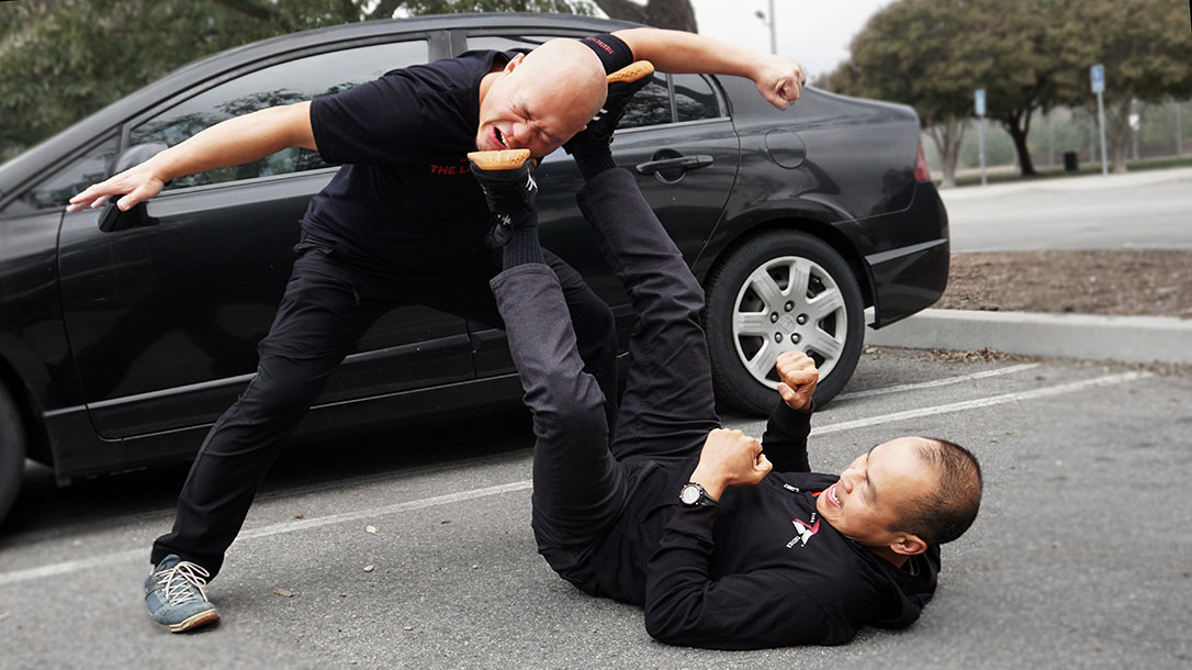 Tiga Tactics instructors Patrick Vuong (top) and Dr. Conrad Bui demonstrate the extreme violence that can be expected in a sudden attack.