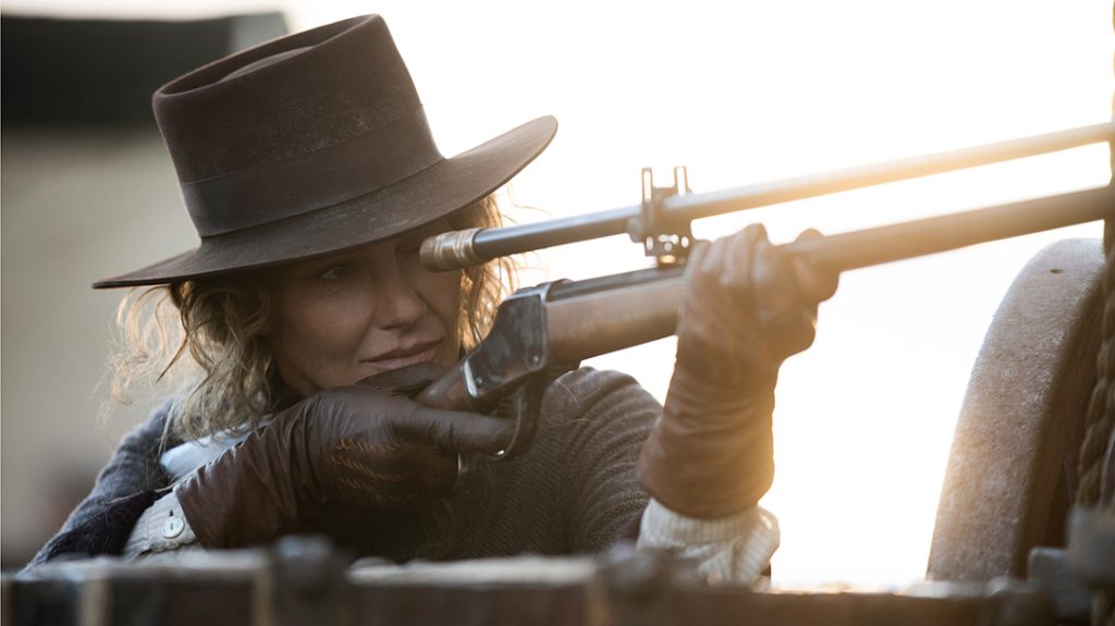Margaret Dutton (Faith Hill) is seen holding the anachronistic Winchester Model 1885 High Wall—fitted with a Hi-Lux Optics Malcolm 6X, 30-inch-long telescopic rifle sight.
