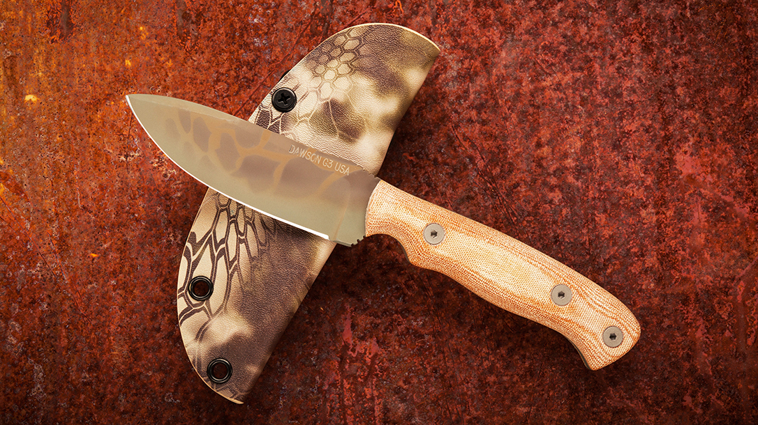 Huntsman knife from Dawson Knives displayed on copper background.