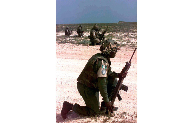 Nigerian troops in Somalia patrol with the FN FAL.