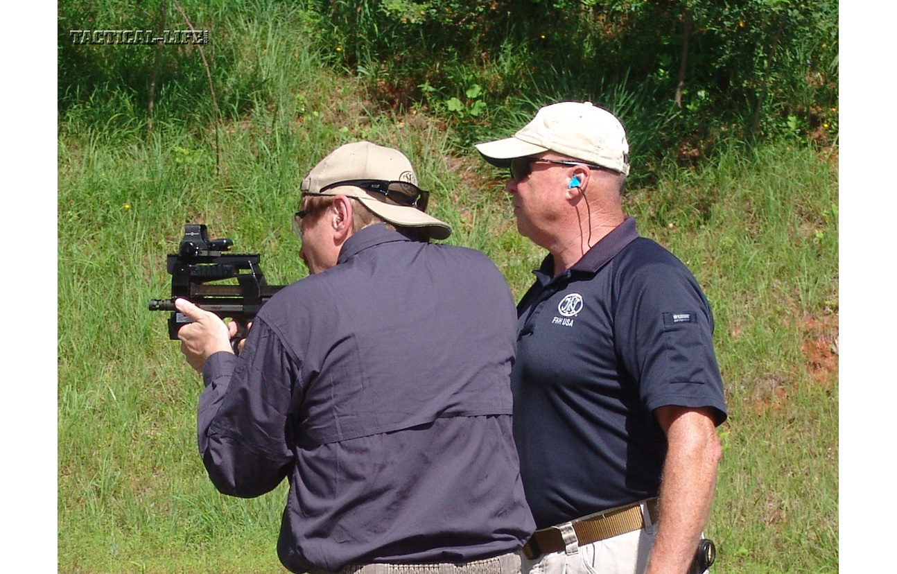 Tactical-Life Visits FNH USA - The author and Bucky Mills with a FNH P90.