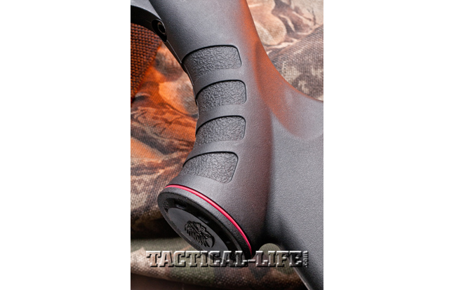 Textured finger grooves in the pistol grip and forend offer greater control, even in slippery conditions. Note the Savage logo in the butt of the grip.