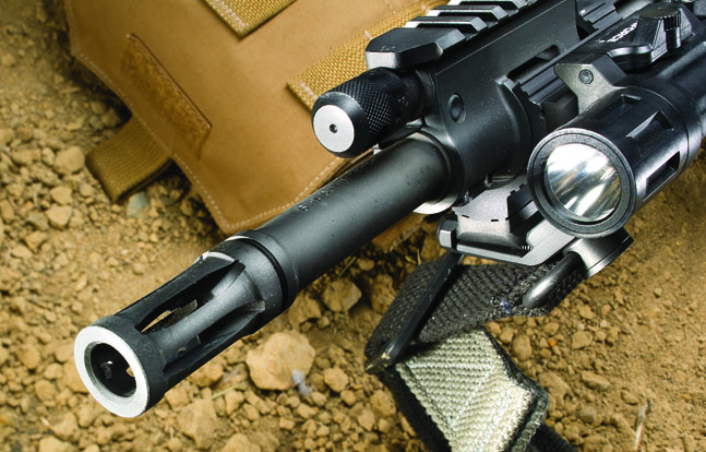 The flash suppressor is cut directly into the barrel to make it a legal 16.12-inch length, even though the rifled portion is only 14.5 inches in length.