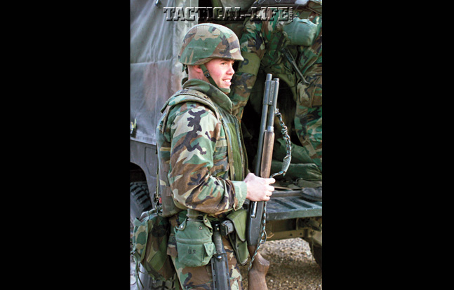 U.S. Marine with 4th Force Service Support Group (FSSG) holds on to a Remington 870 12 gauge during the 2002 Steel Knight exercise in California.