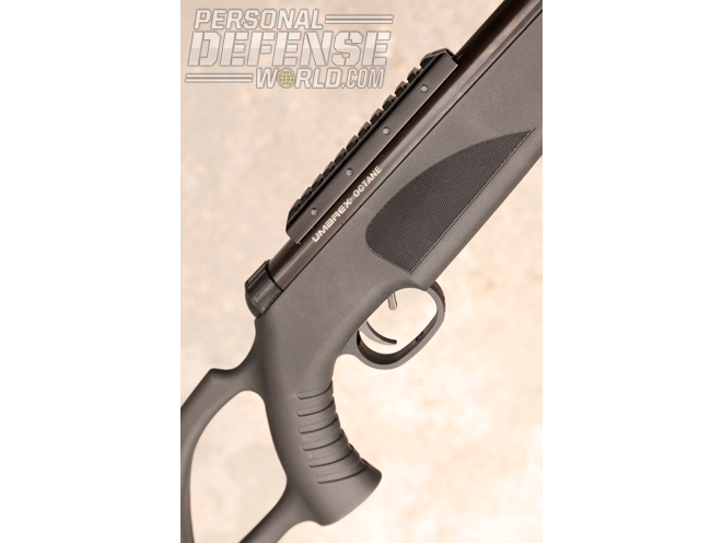 The durable synthetic stock features a thumbhole and a ribbed grip for better control. The safety is a small lever just ahead of the trigger.