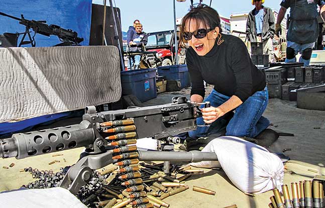 woman shooting a .50 bmg ma deuce machine gun