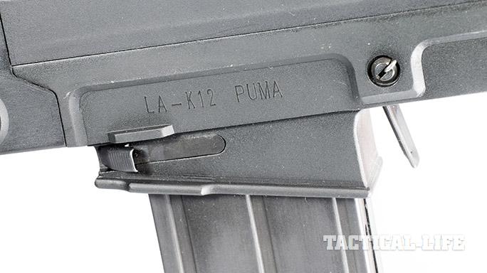 LA-K12 Puma shotgun bolt release