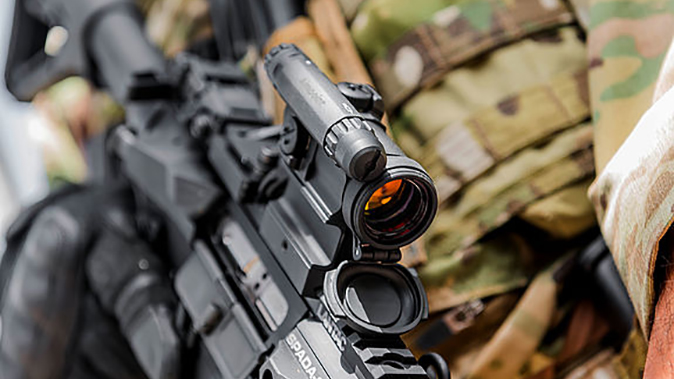 Aimpoint CompM5 sight attached to rifle rail