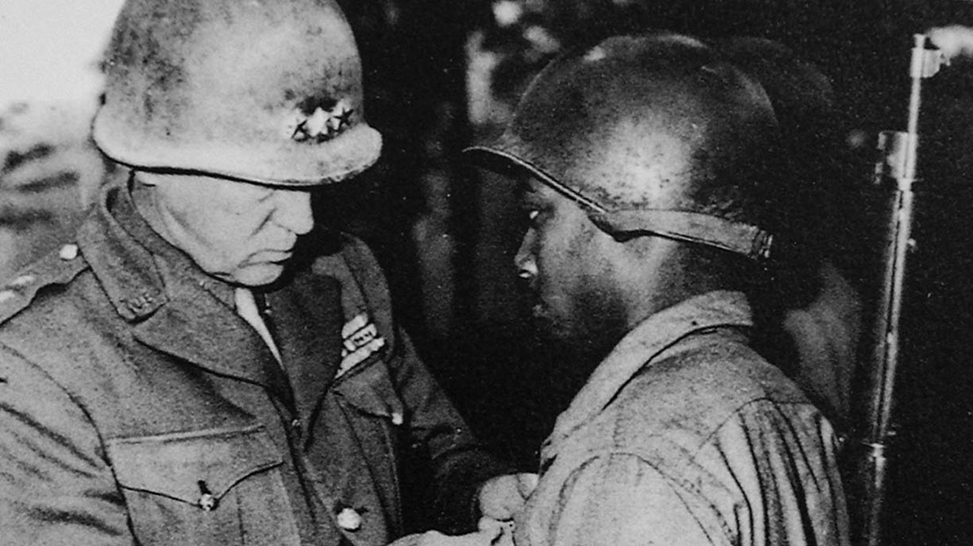 General Patton awards a medal to a soldier in the 761st.