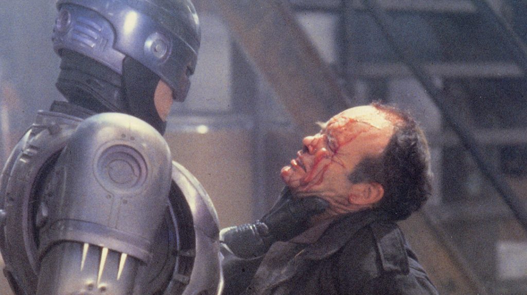 Robocop dealing a beatdown to a bad guy.
